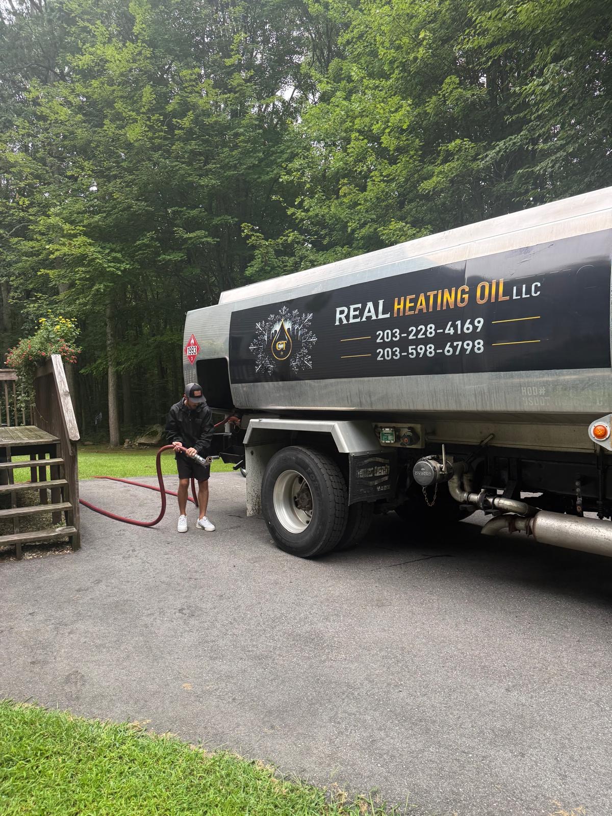 Real Heating Oil truck making a delivery at a Connecticut home